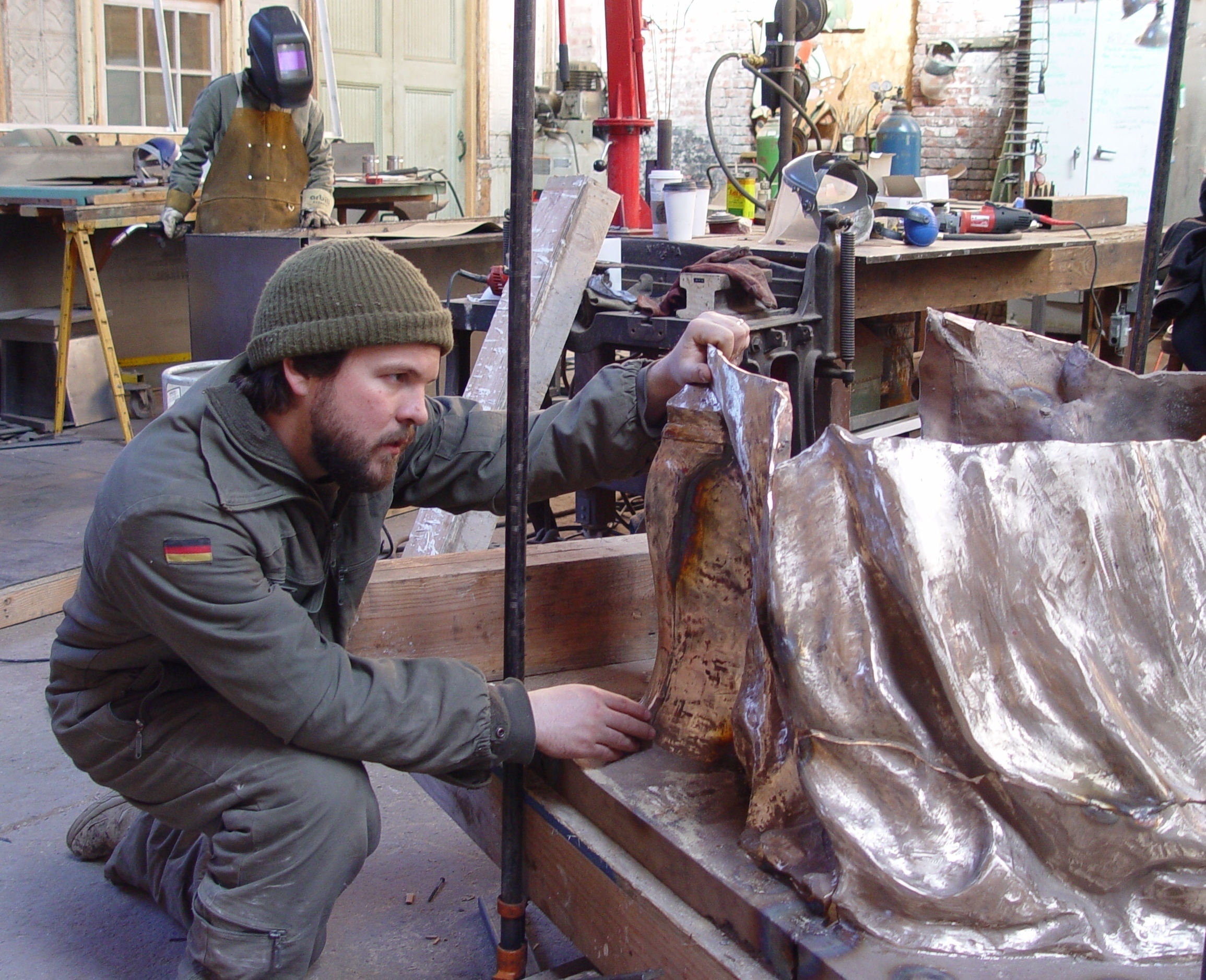 Zach is putting the sections of the bronze together