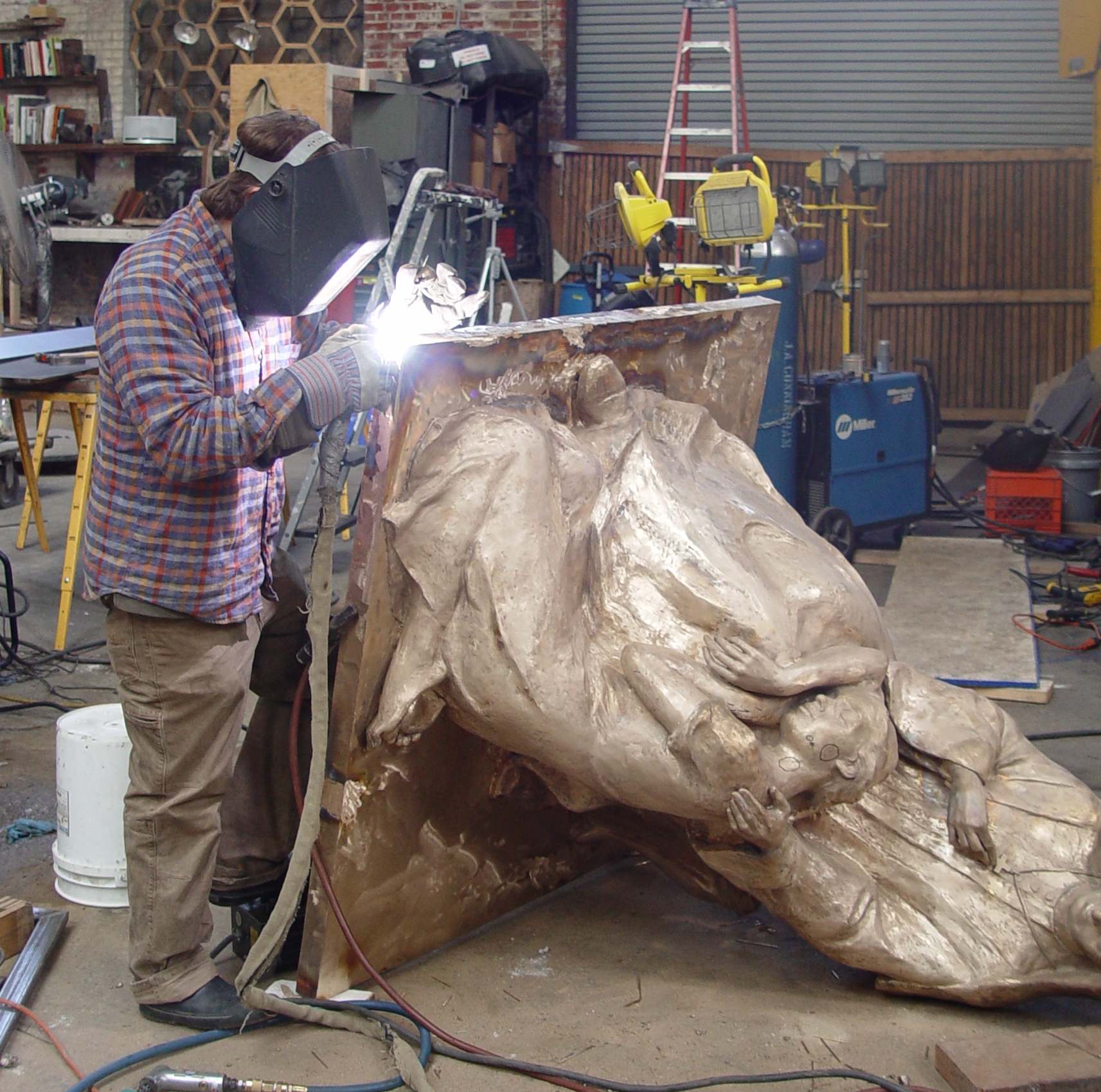 Welding the sections of the statue together